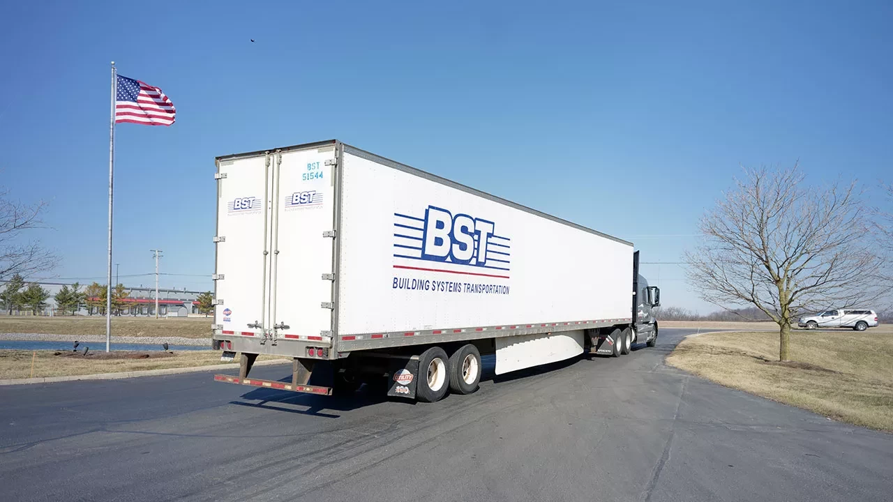 BST Bulk Storage Transport semi-trailer truck parked outside company facility