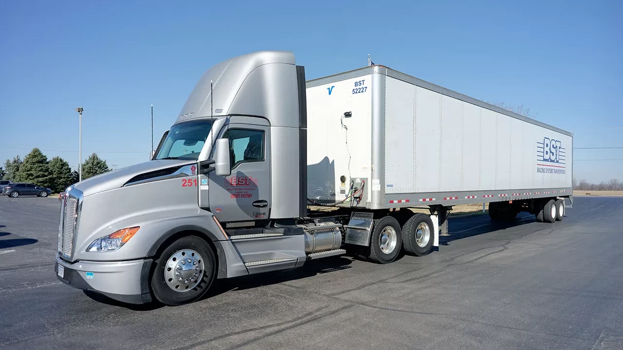BST semi-truck and trailer parked at logistics yard Image